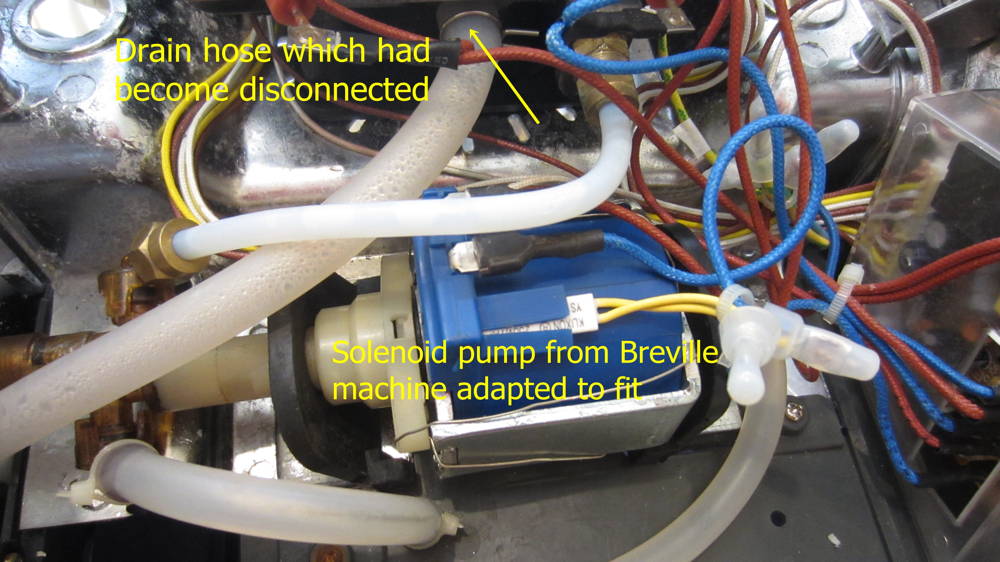 Replacement pump is held in by wire.