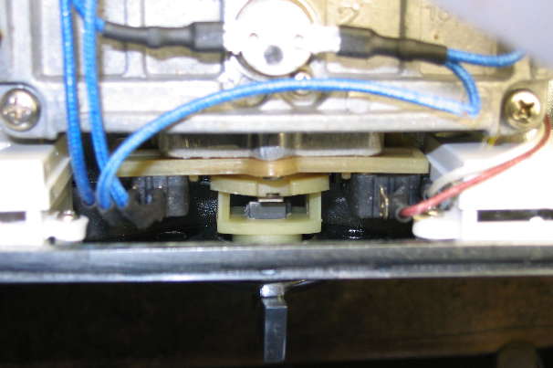 Tab is on the left face of the square knob shaft, when viewed from the front of the machine.