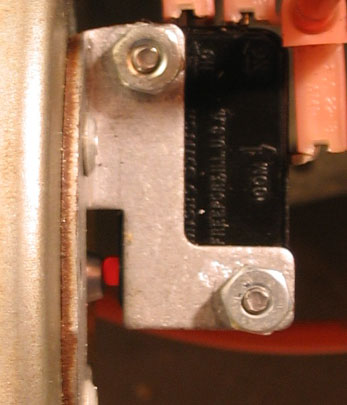 actuator button partially depressed, close-up
