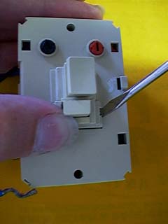 Prying off bulb-change switch assembly
