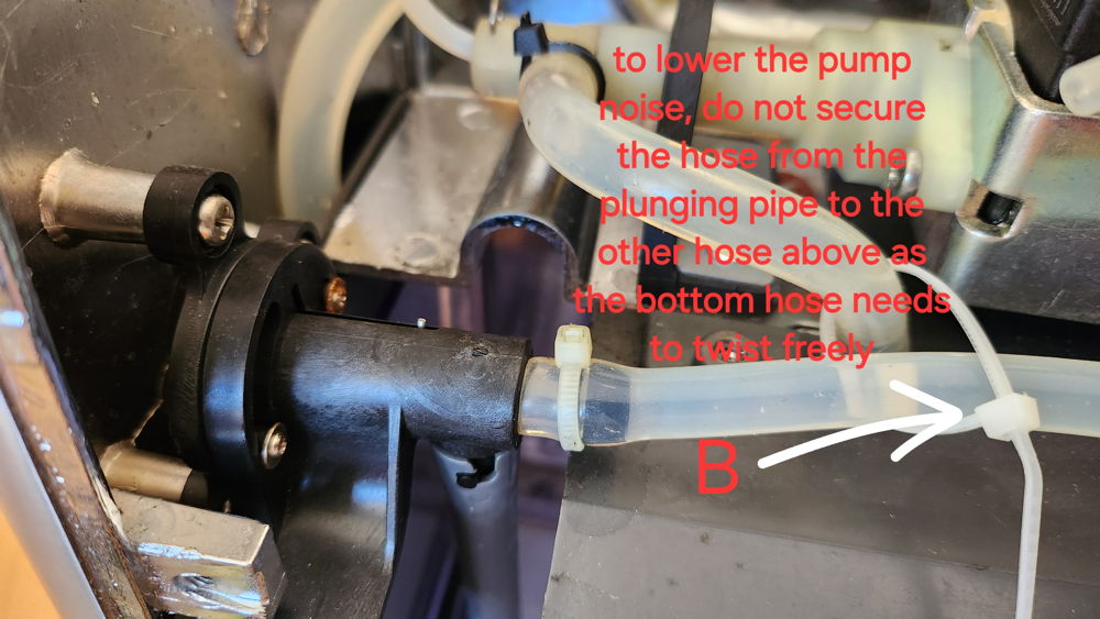 To lower the pump noise, do not secure the hose from the plunging pipe to the other hose above as the bottom hose needs to twist freely.