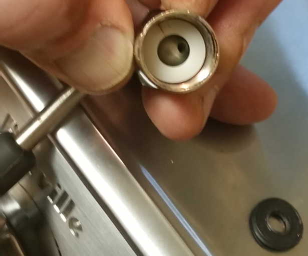 Nylon washer in end of wand, with visible radial split all the way through on one edge
