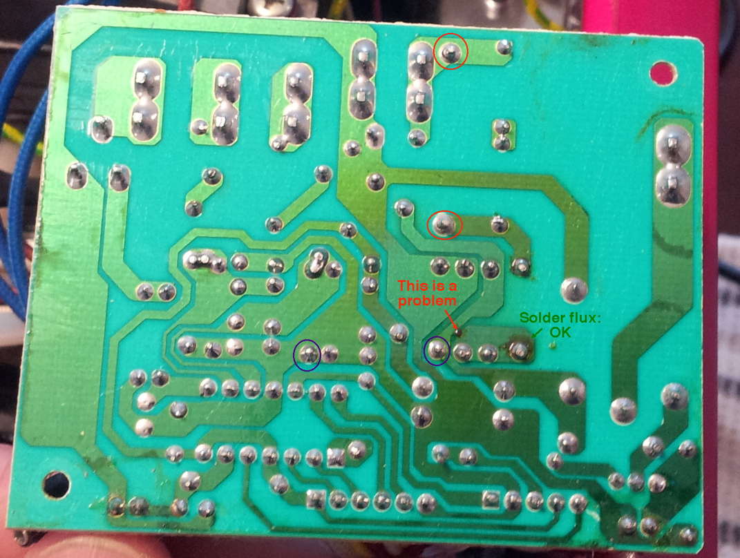 Overall board view, showing not only the fractured joints as above, but a foil to foil arc spot, suspect solder joints, and excess flux