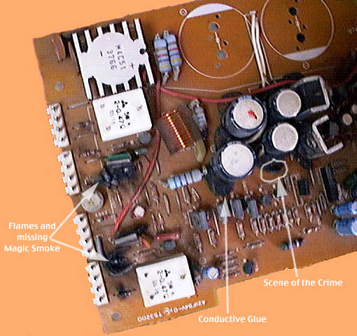 Charring and very black conductive glue are quite visible in this top view of smoked power amplifier printed circuit board.