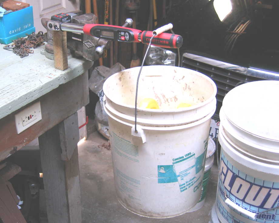 I found that i needed to put a wood block under the end of the Powerbuilt adapter where the Craftsman wrench was attached, to prevent the aluminum block from swiveling downward in the vise jaws.