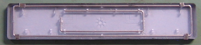 metal retaining pieces atop stock space bar stiffening wire pivot points