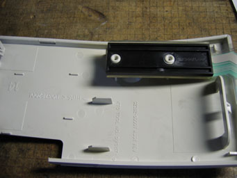 Original switch assembly, held by melted plastic