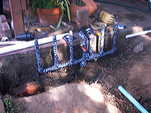 manifold pipes being wrapped